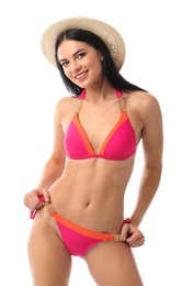 Beautiful young woman in stylish bikini with hat on white background