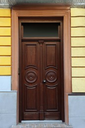 Photo of Entrance of house with beautiful wooden door and transom window