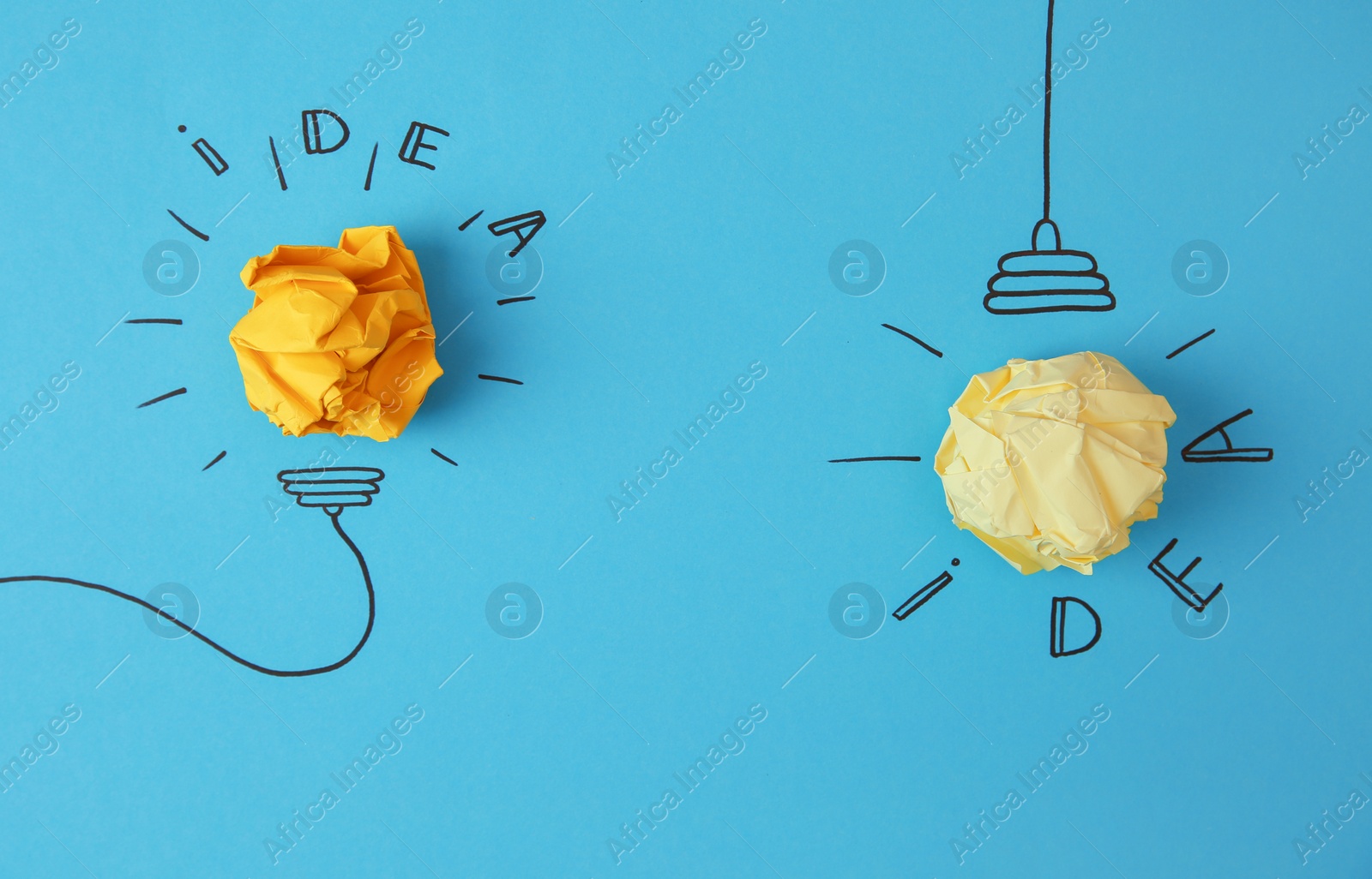 Photo of Flat lay composition with crumpled paper as lamp bulbs and words IDEA on color background