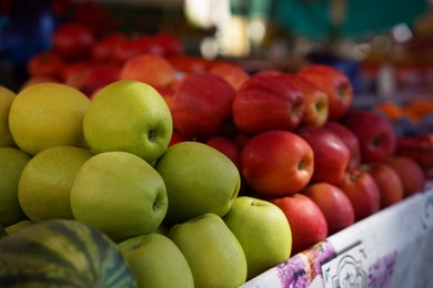 Photo of Different fresh ripe fruits on counter at market, closeup