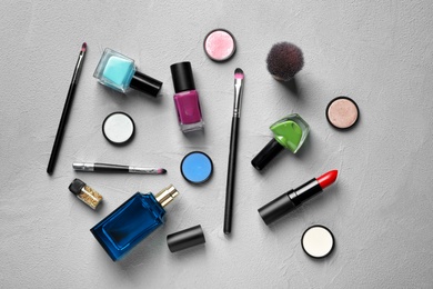 Photo of Flat lay composition with decorative cosmetics on gray background