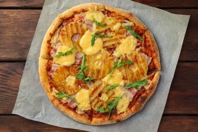 Delicious pineapple on wooden table, top view