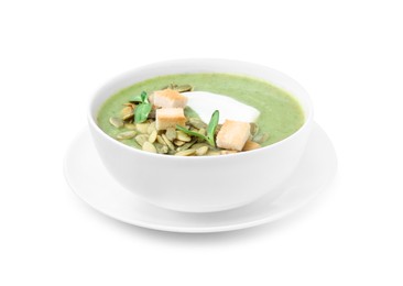 Delicious broccoli cream soup with croutons, sour cream and pumpkin seeds isolated on white