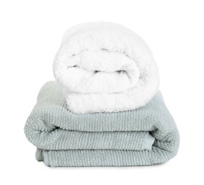 Photo of Different folded soft towels isolated on white