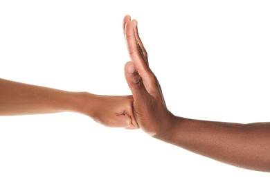 African American man stopping woman's fist on white background, closeup. Antiracism concept