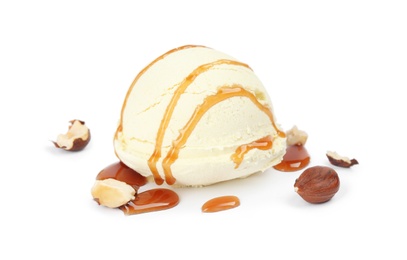 Photo of Ball of delicious vanilla ice cream with hazelnuts and sauce on white background