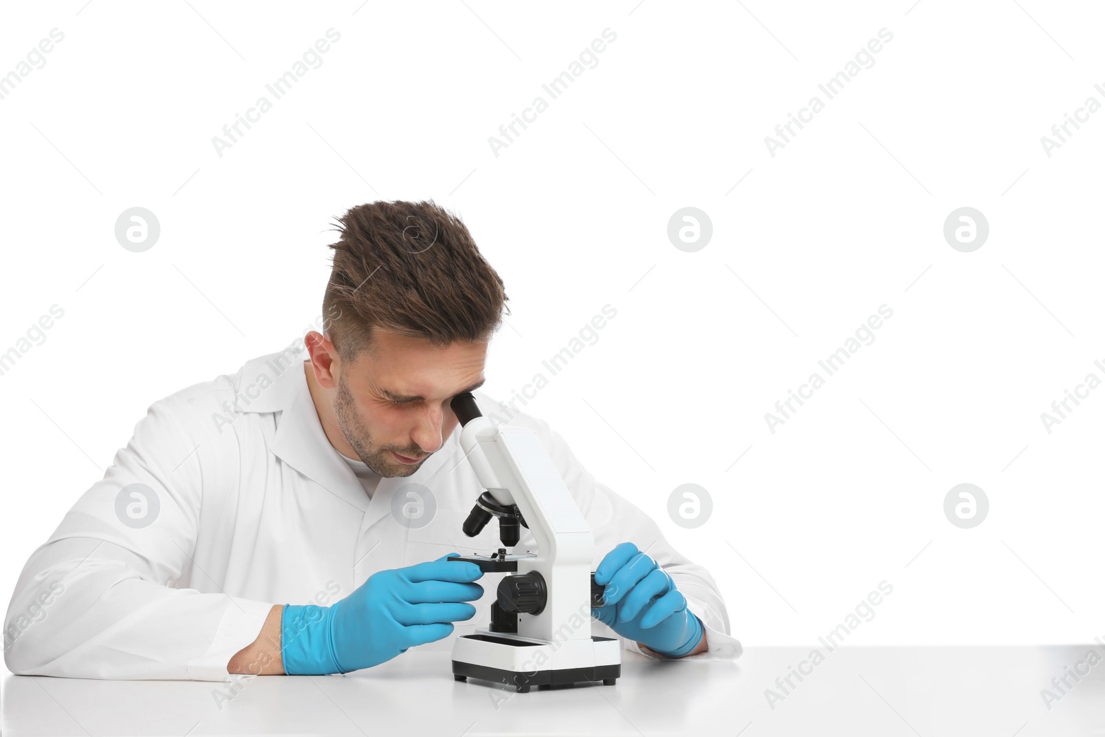 Photo of Scientist using modern microscope at table isolated on white. Medical research