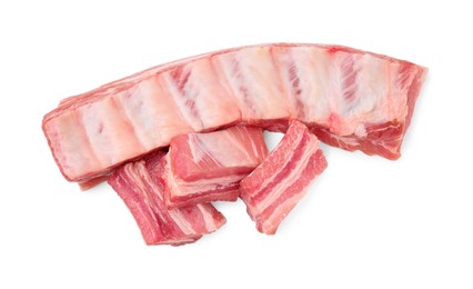Photo of Raw pork ribs isolated on white, top view