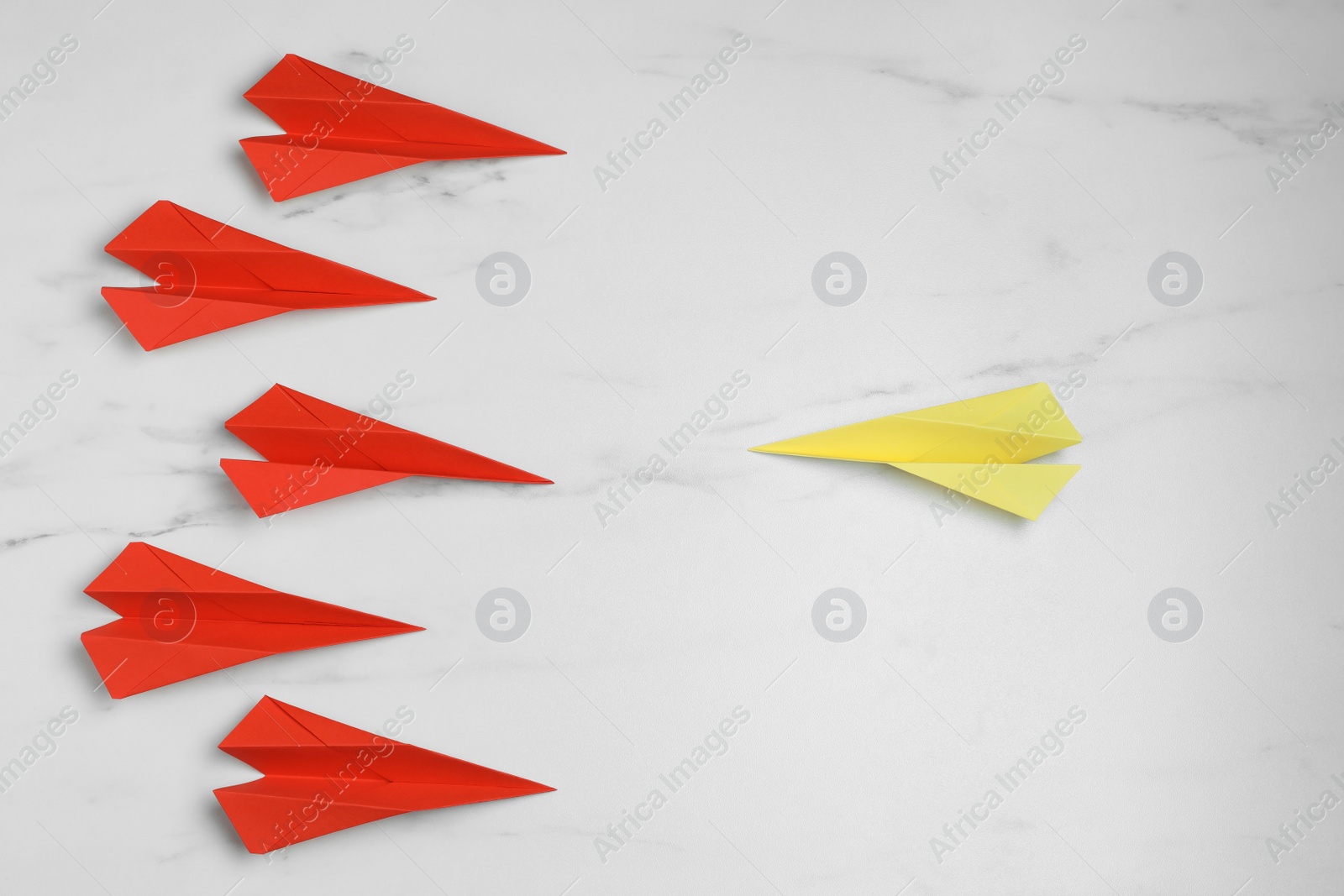 Photo of Flat lay composition with paper planes on white marble table