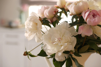 Photo of Beautiful peony bouquet against blurred background, closeup