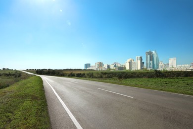 Image of Empty asphalt road and beautiful view of cityscape on sunny day