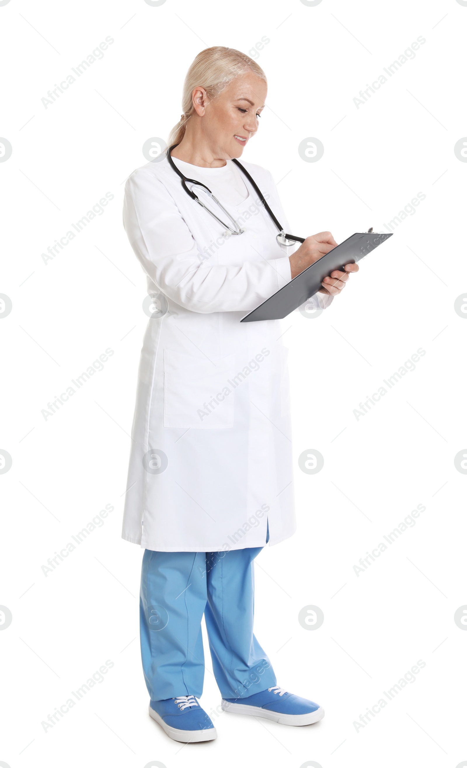 Photo of Full length portrait of female doctor with clipboard isolated on white. Medical staff