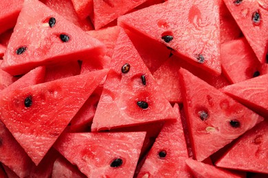 Photo of Delicious fresh watermelon slices as background, closeup