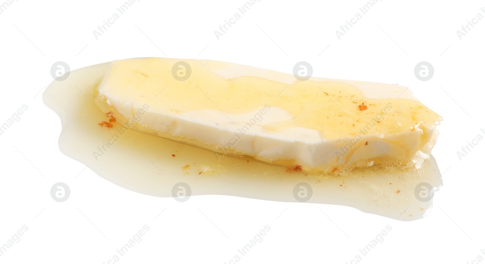 Photo of Piece of melting butter on white background