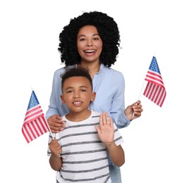 Image of 4th of July - Independence day of America. Happy woman and her son with national flags of United States on white background