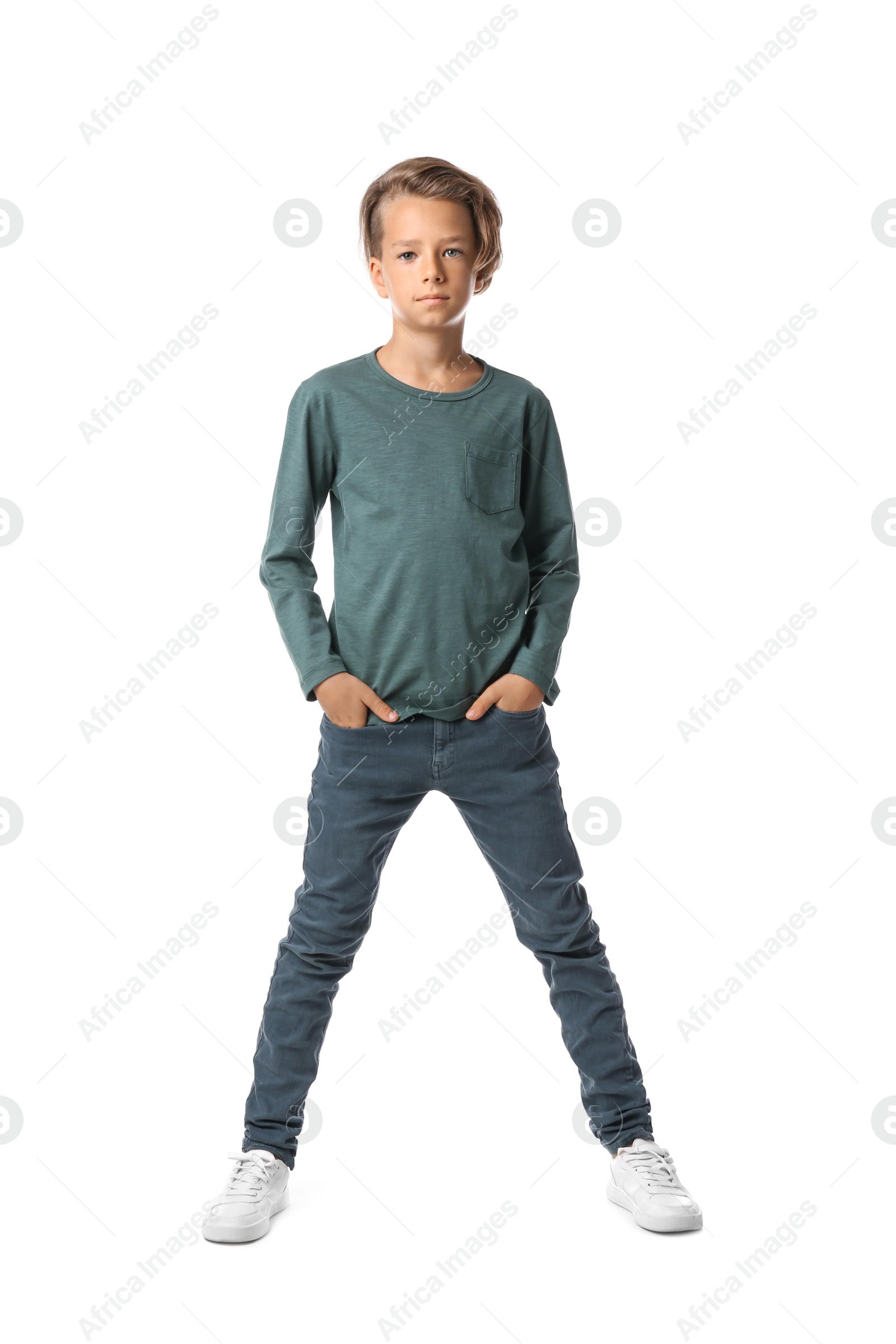 Photo of Portrait of cute little boy in casual outfit on white background