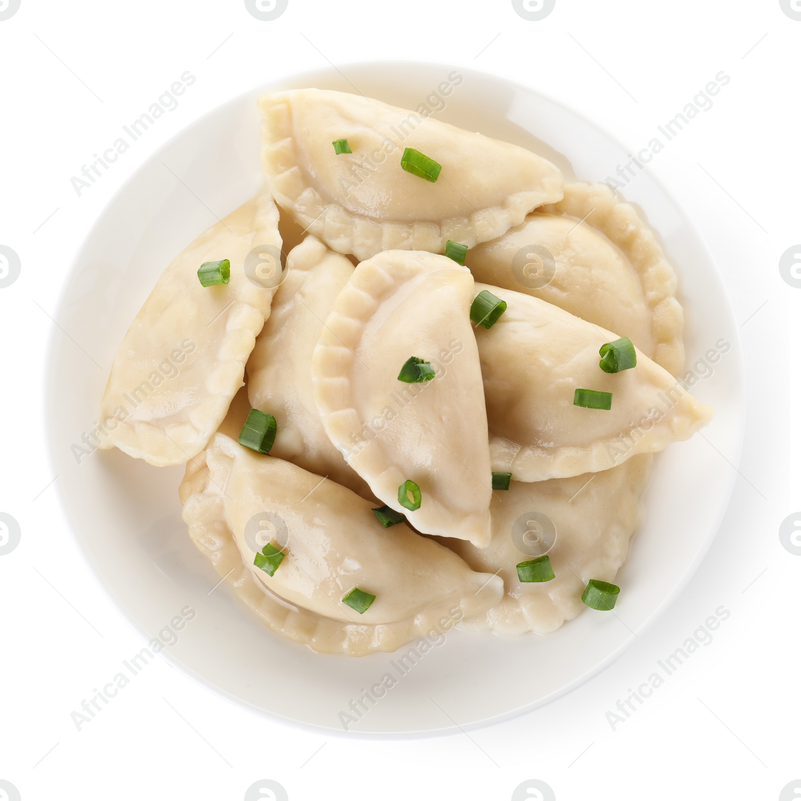 Photo of Plate of tasty cooked dumplings isolated on white, top view