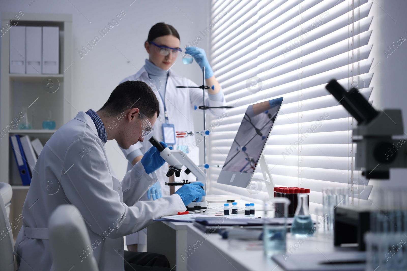 Photo of Scientists working with samples in laboratory. Medical research