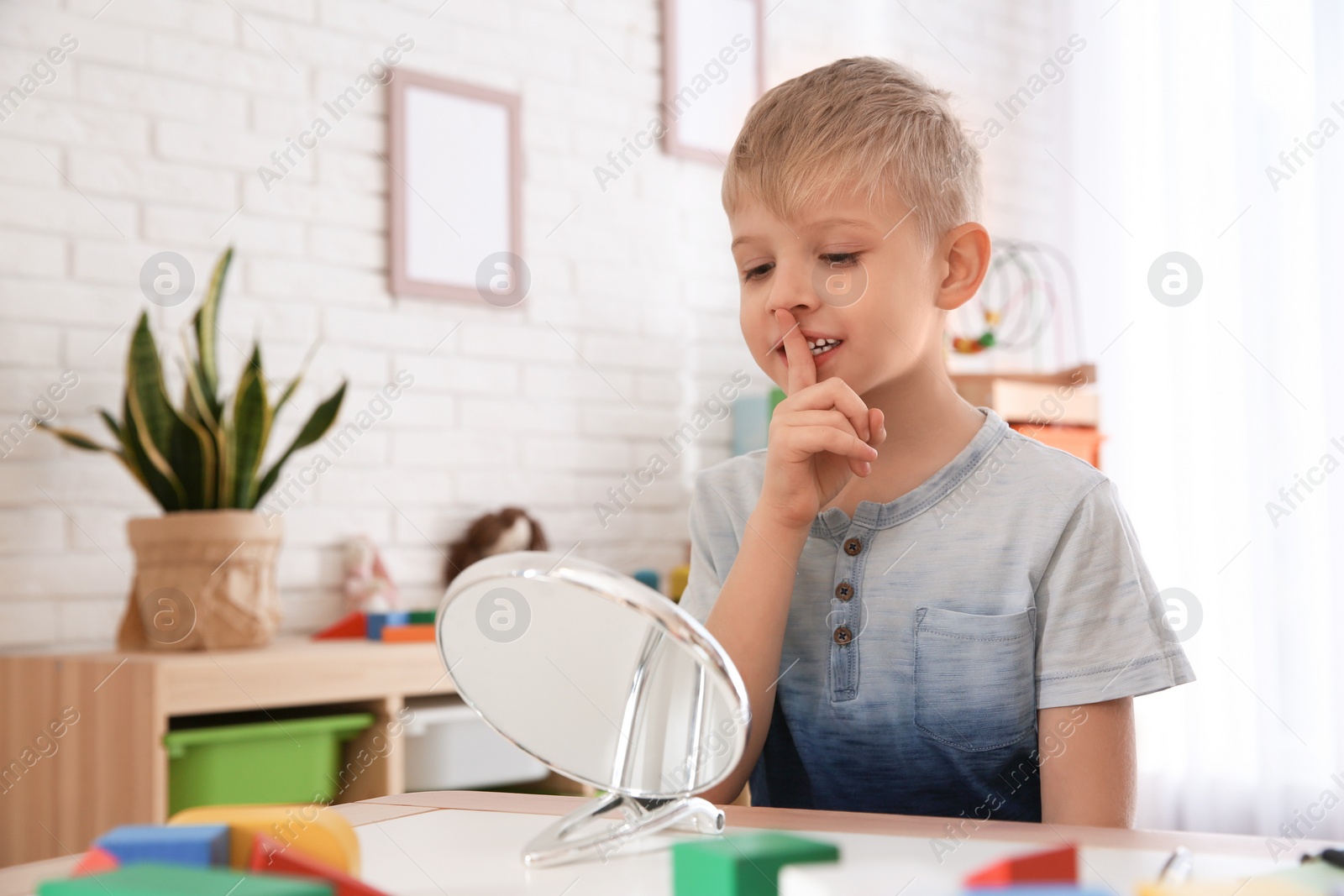 Photo of Cute little boy at speech therapist office