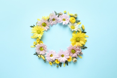 Photo of Beautiful chamomile flowers on color background, flat lay with space for text