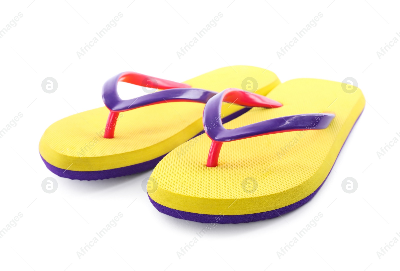 Photo of Pair of stylish yellow flip flops isolated on white. Beach object