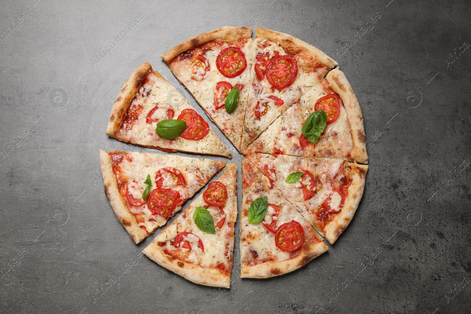 Photo of Delicious pizza Margherita on grey table, flat lay