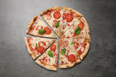 Delicious pizza Margherita on grey table, flat lay