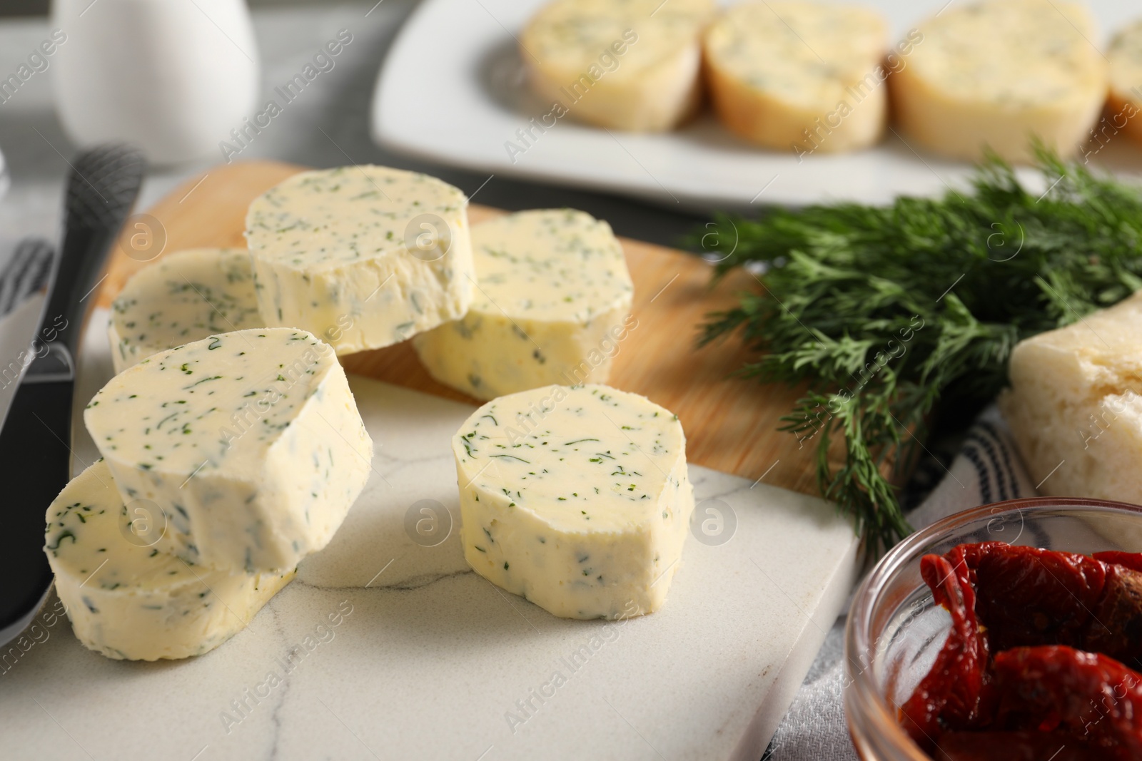 Photo of Tasty butter, dill and chili pepper on table, closeup