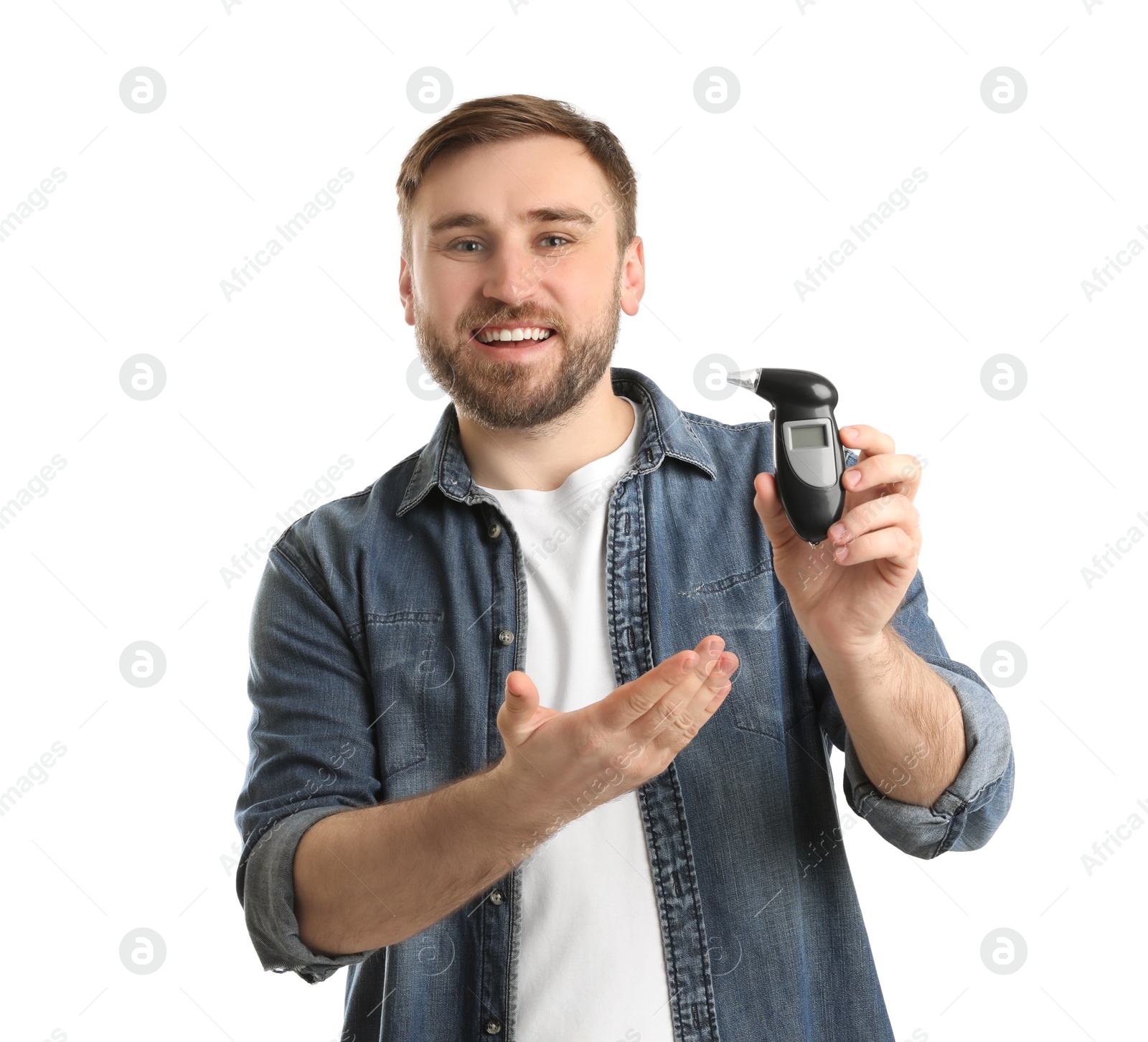 Photo of Happy man with breathalyzer on white background