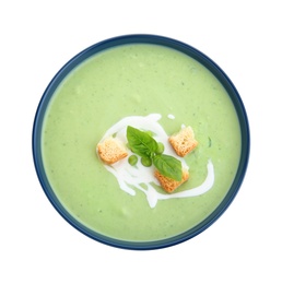 Photo of Green pea soup with croutons in bowl on white background, top view