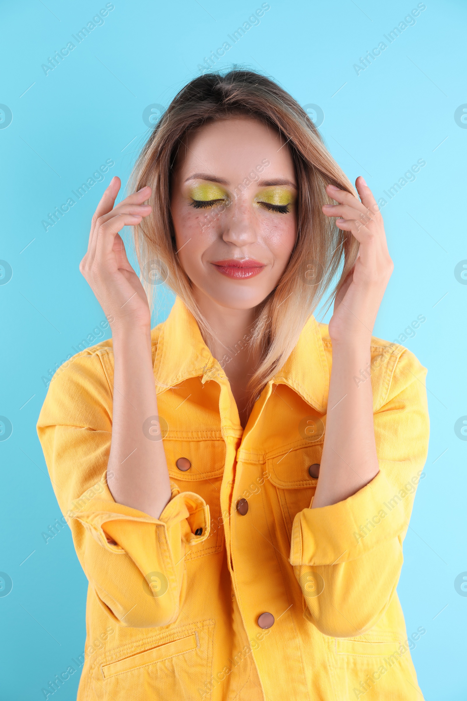 Photo of Beautiful young woman posing on color background. Summer fashion