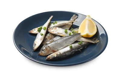 Photo of Fresh raw sprats, green onion and cut lemon isolated on white