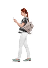 Photo of Woman with backpack using smartphone on white background