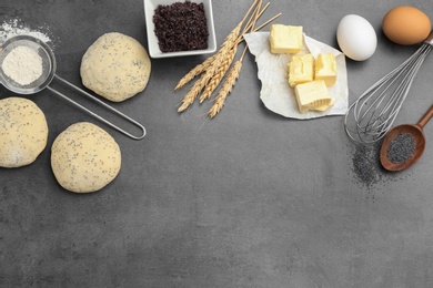 Photo of Flat lay composition with raw dough and ingredients on grey background