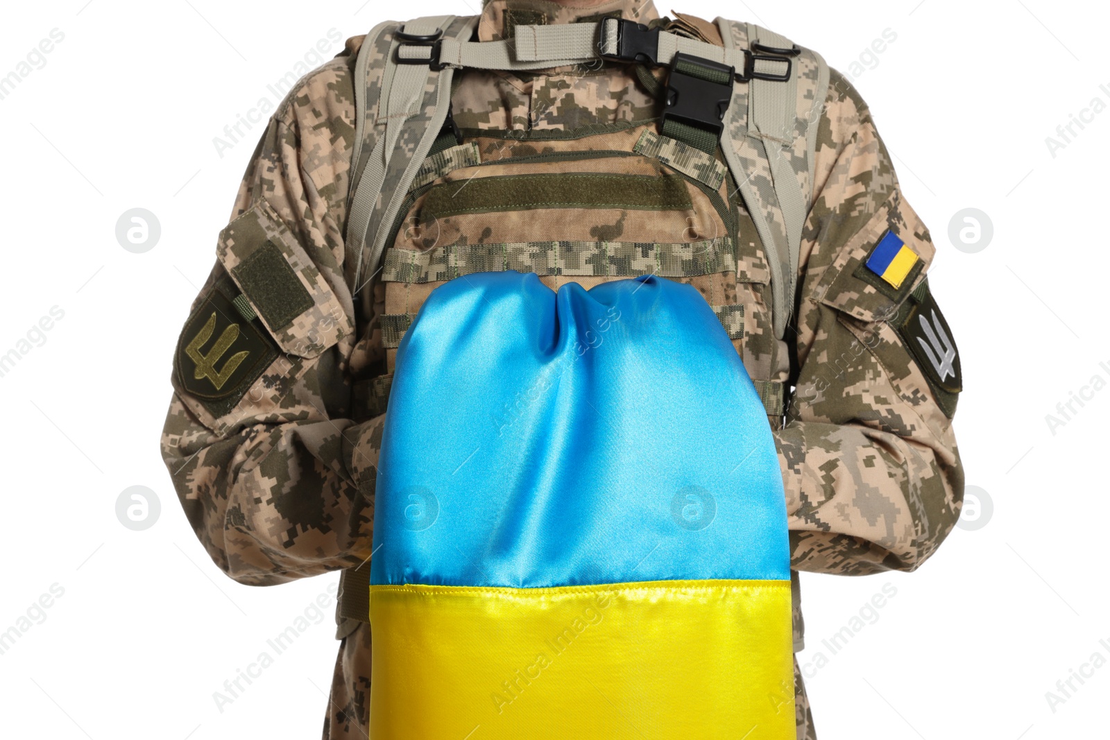 Photo of Soldier in military uniform with Ukrainian flag on white background, closeup