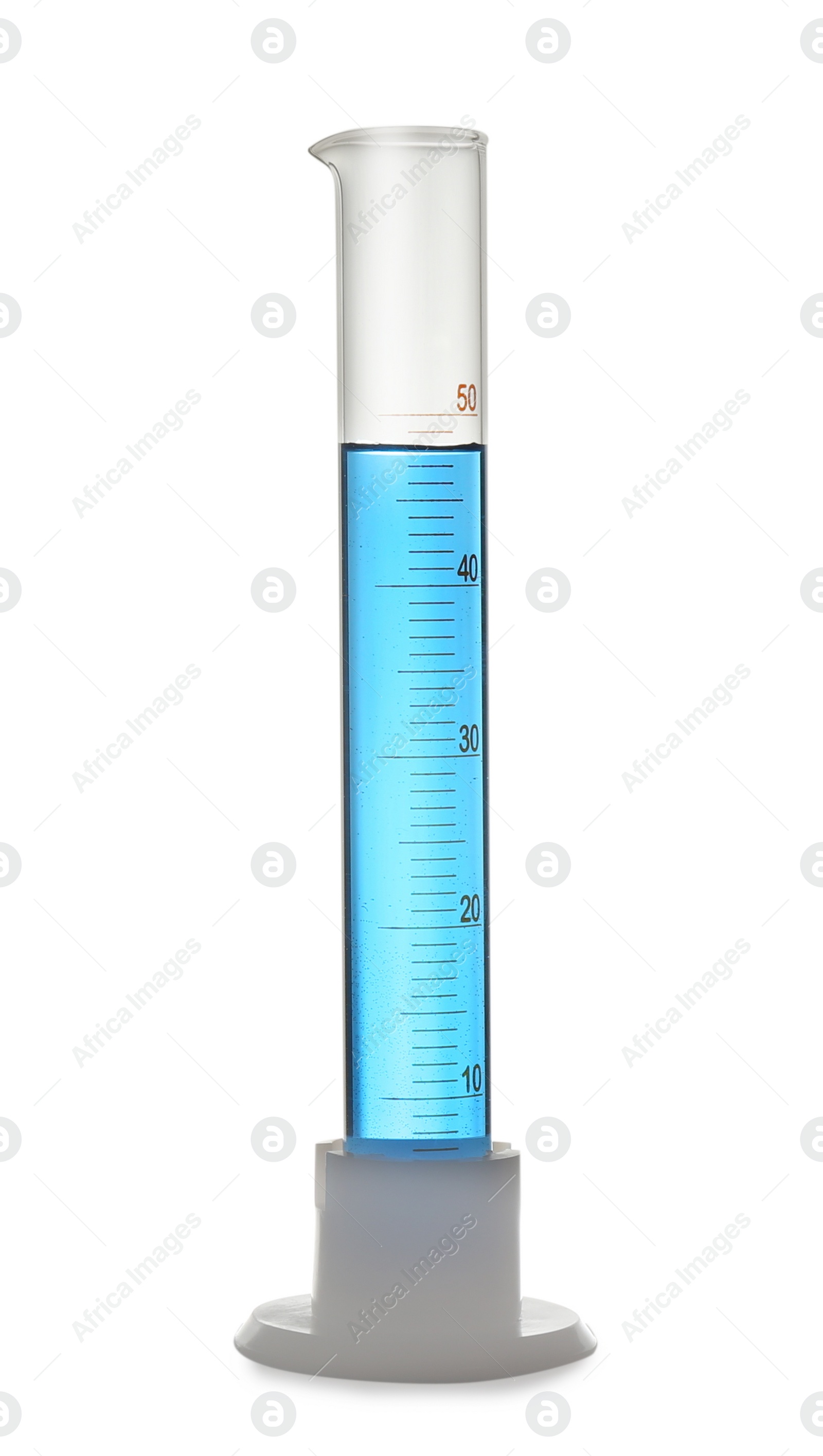 Photo of Graduated cylinder with light blue liquid isolated on white