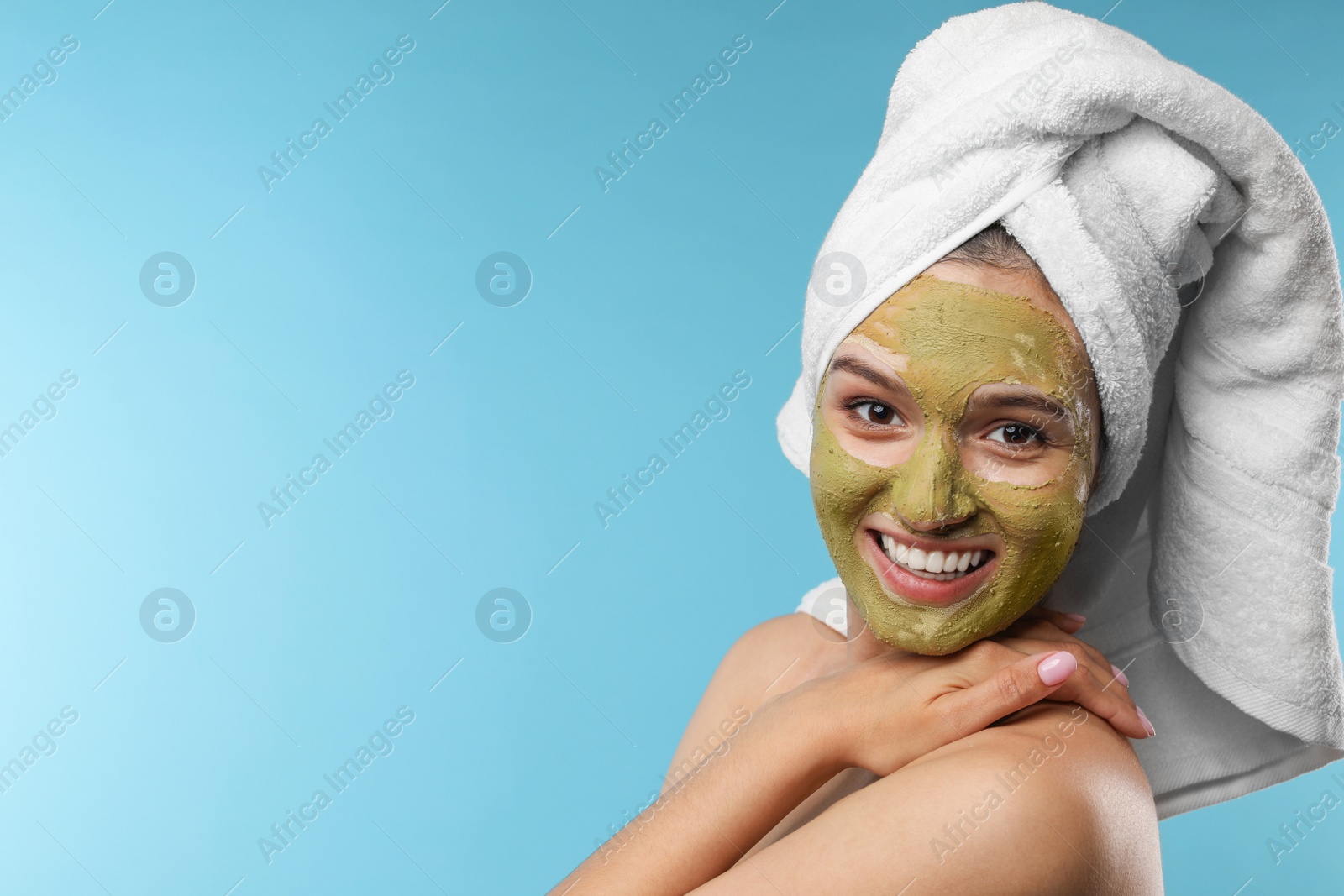 Photo of Beautiful woman with mask on face against color background. Space for text