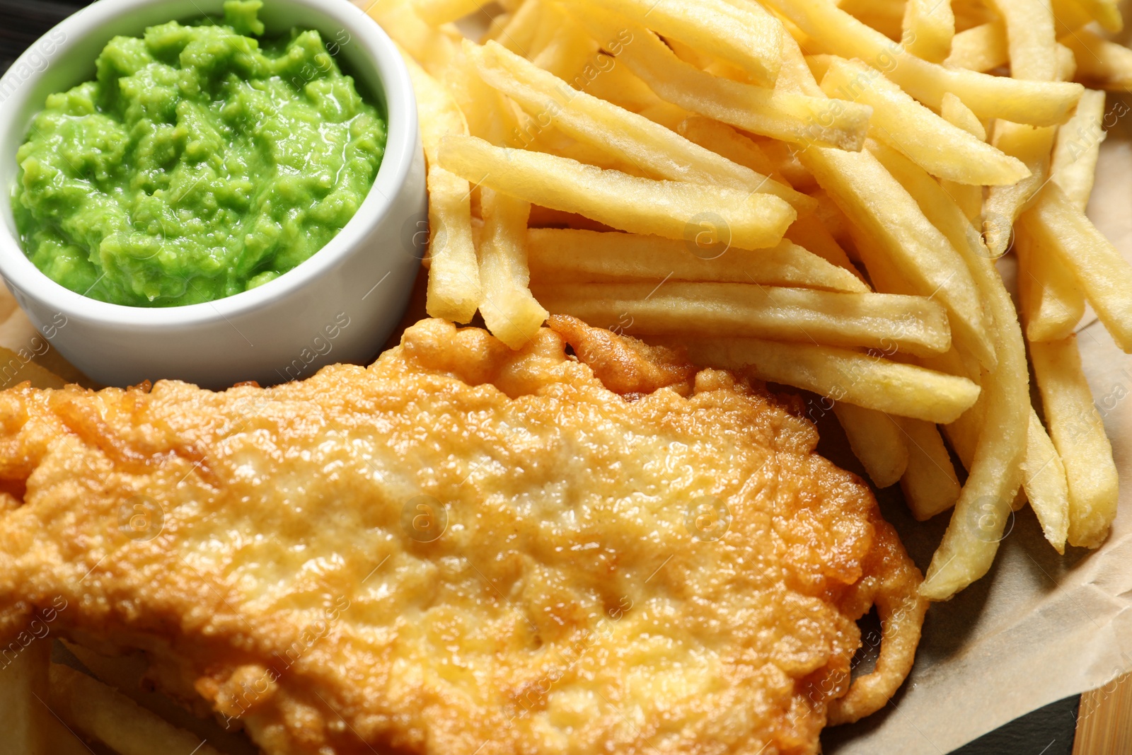 Photo of British Traditional Fish and potato chips, closeup view