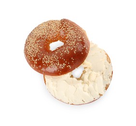 Photo of Delicious fresh bagel with cream cheese on white background, top view