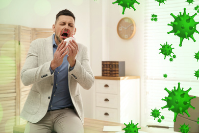 Image of Sick man sneezing in office. Dangerous virus