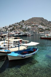 Photo of Beautiful view of coastal city with different boats on sunny day