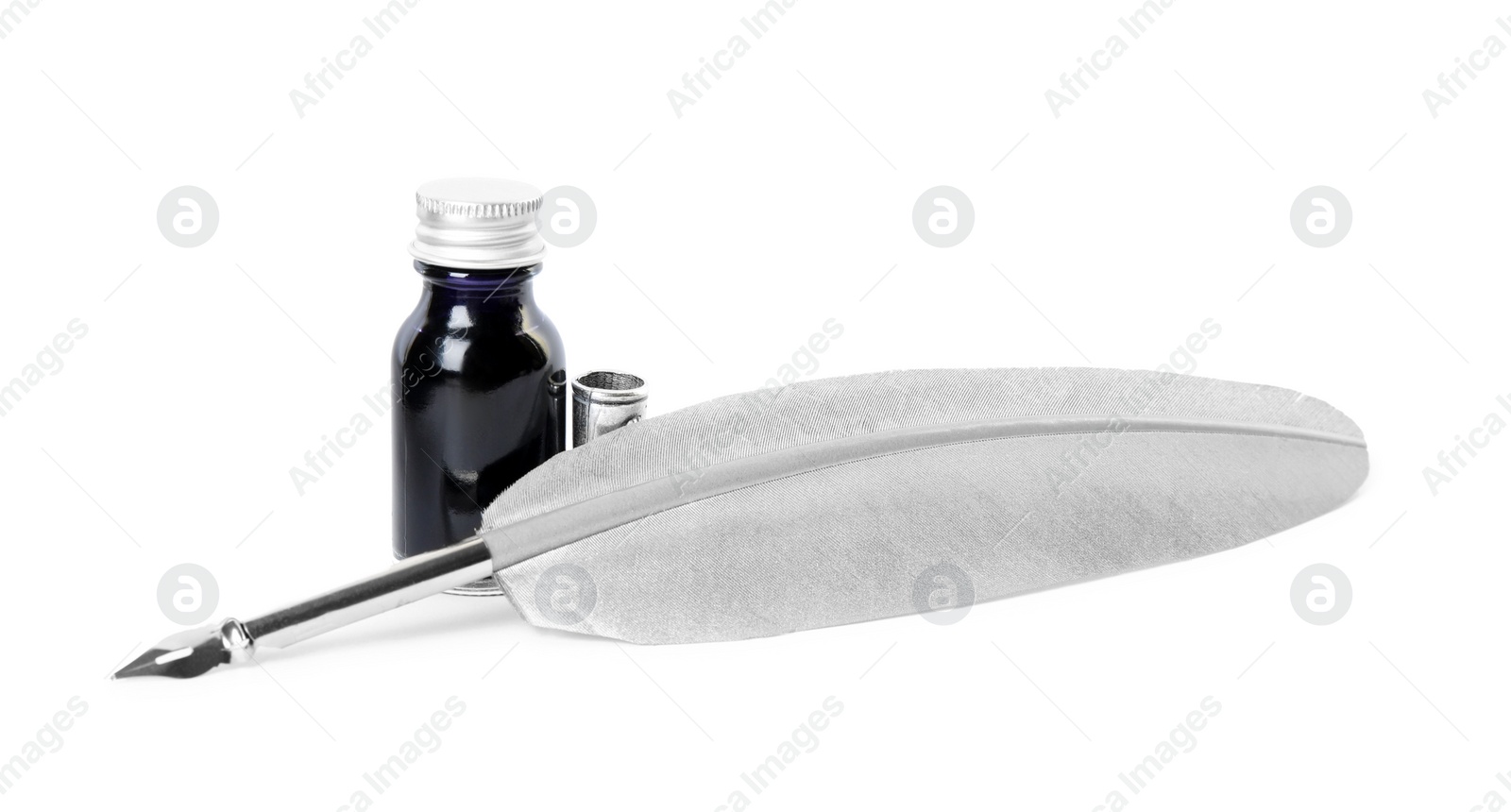 Photo of Feather pen and bottle of ink on white background