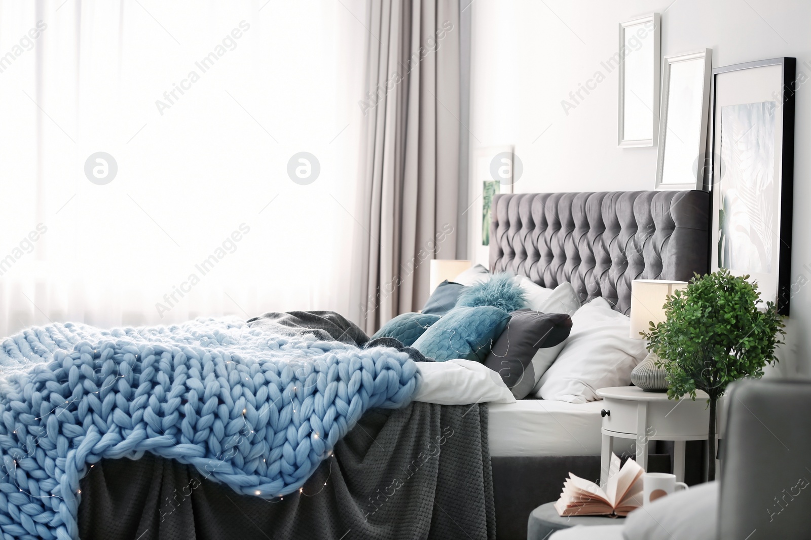 Photo of Modern room interior with comfortable bed