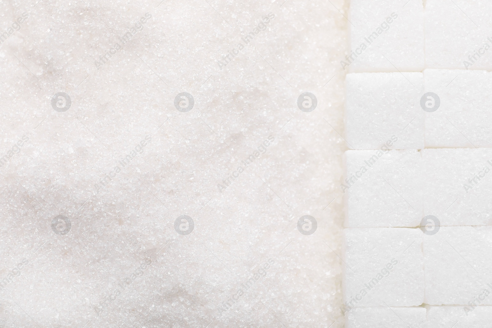 Photo of Different types of white sugar as background, top view. Space for text