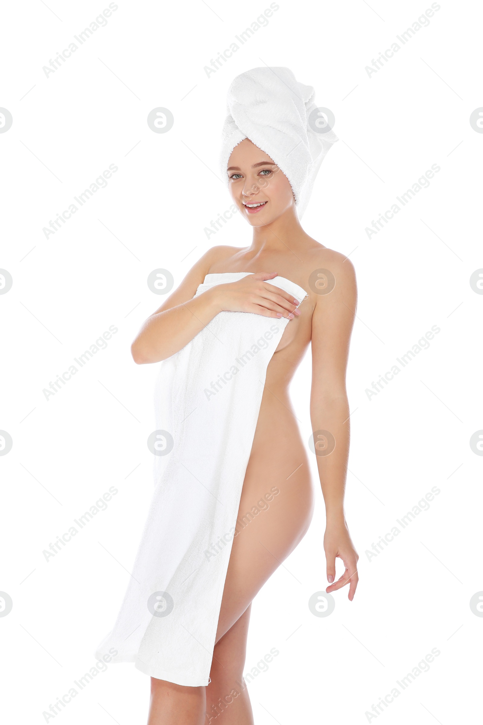 Photo of Portrait of young pretty woman with towels on white background