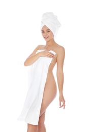 Photo of Portrait of young pretty woman with towels on white background