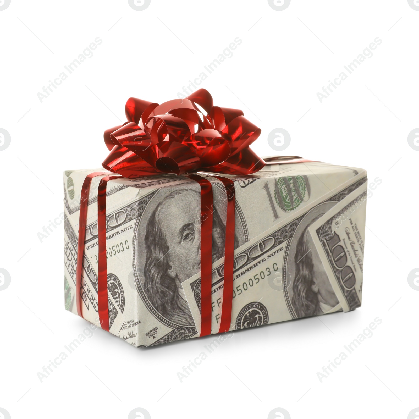 Photo of Gift box wrapped in decorative paper with dollar pattern on white background