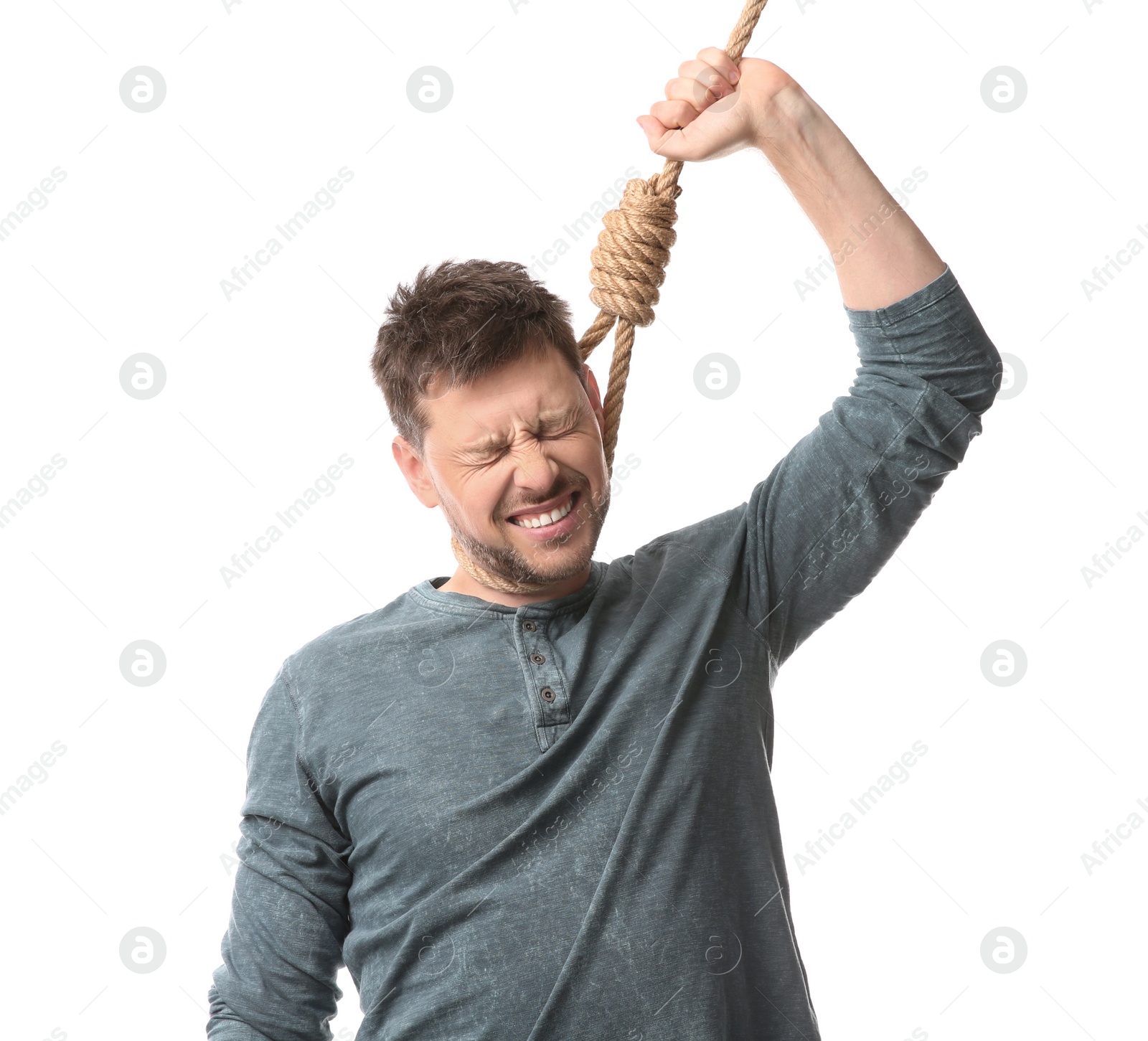 Photo of Depressed man with rope noose on neck against white background