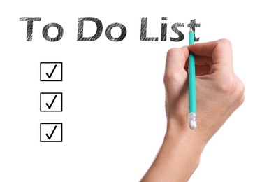 Image of Woman writing words To Do List with pencil on white paper, closeup. Illustration of check boxes with marks