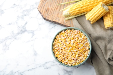 Photo of Flat lay composition with dried corn kernels on marble background. Space for text